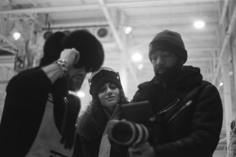 Reviewing a camera monitor together in black and white
