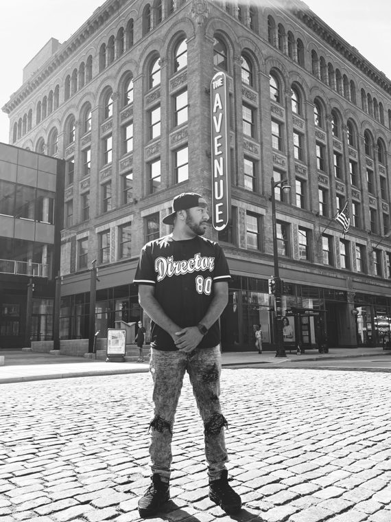 Black-and-white portrait outside The Avenue