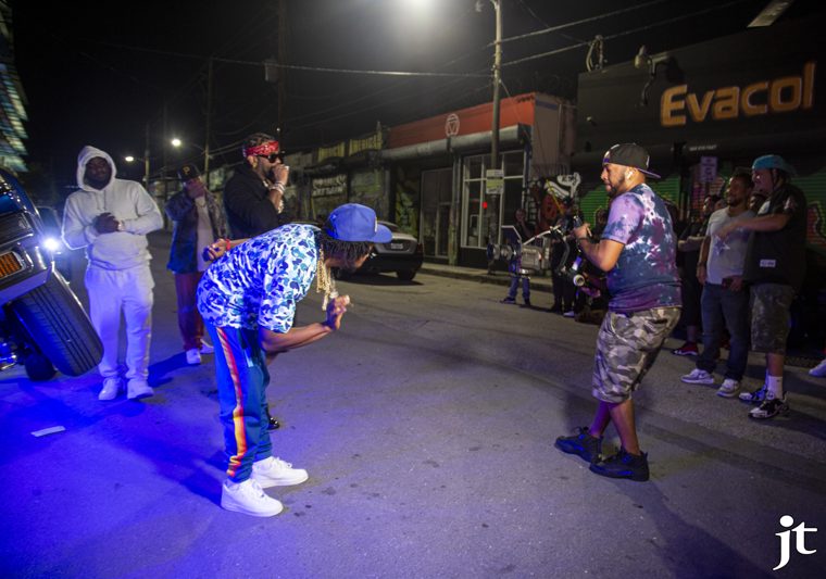 Filming a nighttime street performance